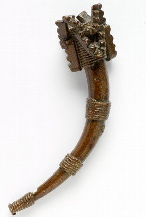Goldweight in the form of an ivory warhorn, Ghana, 19th century, cast brass. Museum no. CIRC.82-1971