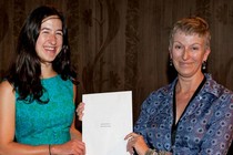 Marta Orbach receiving the Word and Image award from curator, Gill Saunders 