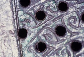 Lamp holder surface showing the spotty appearance of bronze disease. © Sophy Wills