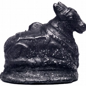 The object is a 19th Century bronze statue of Nandi, the Kneeling bull of Shiva. (Museum no IM 69-1914)