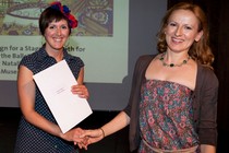 Eleanor Vallerini receiving the Fashion and Textiles award from Suzana Skrbic on behalf of Oriole Cullen
