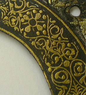 Figure 5. Detail of plaque showing that it has been cut down , Photography by Sophia Wills  © Victoria and Albert Museum, London