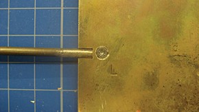Figure 2. Attaching the removable arm in place to the back plate with an M2 screw (Photography by Hannah Brown)