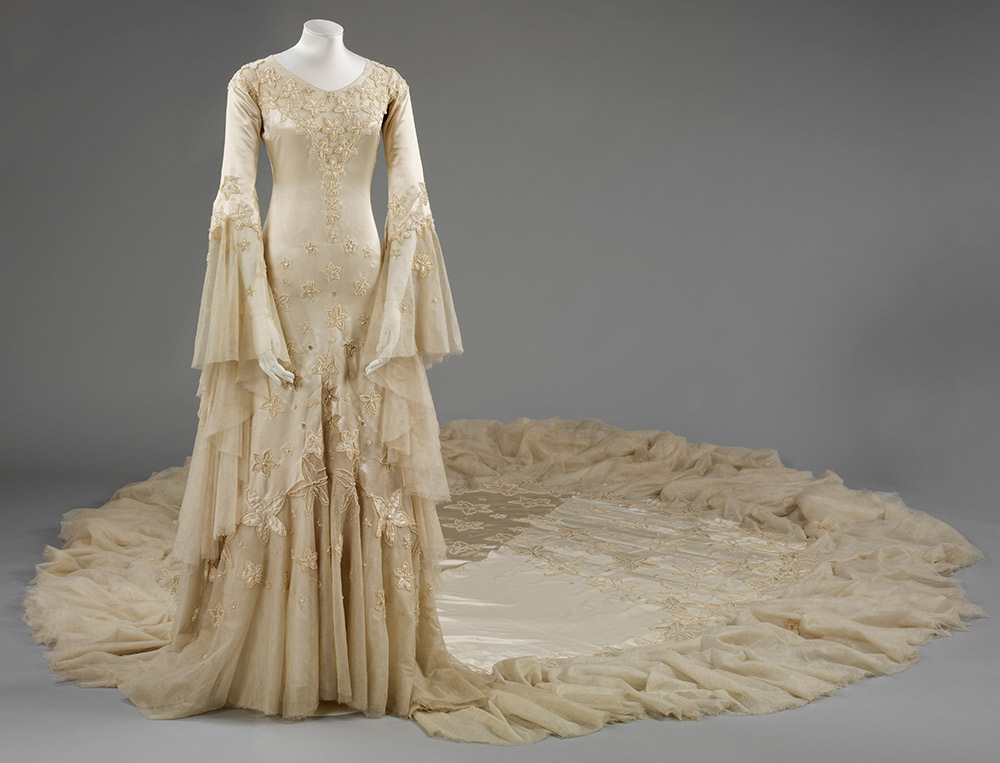  Silk satin wedding dress, designed by Norman Hartnell, 1933, given and worn by Margaret, Duchess of Argyll. © Victoria and Albert Museum, London