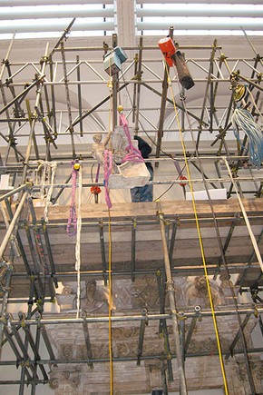 Figure 7. Installation of the dormer window, raising stone figure into position (Photography by Matthew Rose)