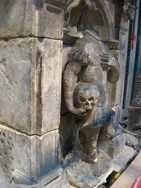 Figure 2. Headless stone figure during installation (Photography by Matthew Rose)