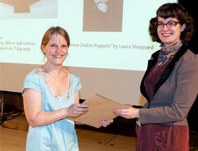 Laura Sheppard receiving the Word and Image award from curator Ella Ravillious