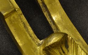 Figure 4. Past abrasive treatments have worn through the gilding on this mount (object 1028-1882)