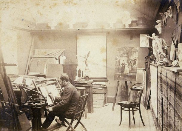 Lucien Henry (1850-1896) in his studio 1890. Note the cast of David’s ears in the upper right corner of the photo.