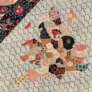 Figure 15 - The Sundial Coverlet, 1797, England. Museum no. T.102-1938. Detail of a map of England; the map is pieced over papers and embroidered.