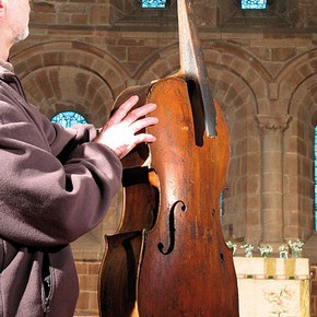 Figure 2. The author holding the Berkswell 'Cello inside the church of St. John Baptist, Berkswell, Warwickshire (Photography by Karen Lacroix)