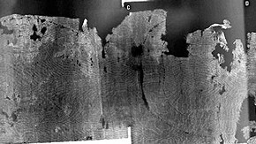 Figure 2. X-radiograph of the lower edge of the tunic (291-1891) with bright white (denser) 'tide-line' pattern, consistent with water staining and movement of debris to edge of wet region (Photography by Paul Robbins, mosaic by Sara Gillies)