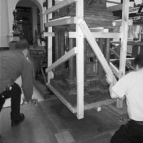 Figure 2. Braced-off model being lowered onto corner wheels, after removal of upper section. Photography by Claira Partington.