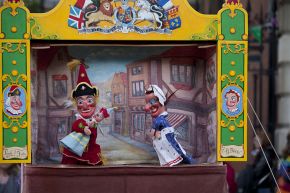 Judy gives Mr Punch the baby to look after. Geoff Felix's Punch and Judy show, May Fayre, Covent Garden, May 2012. © Victoria and Albert Museum, London. 