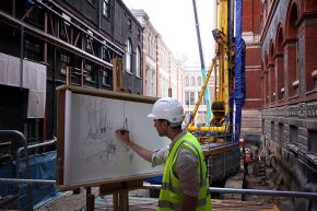 Liam O’Connor working on the scroll at the building site