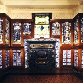 The Poynter Room, showing the grand iron stove.