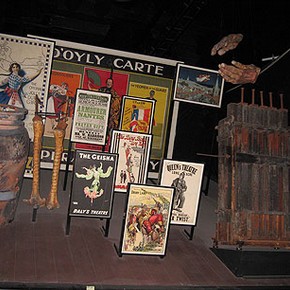 Figure 3. A Theatre Museum display before de-installation showing large, heavy and awkward objects such as a billboard poster, a wind machine and props including an Ali Baba pot, and ostrich legs (Photography by Merryl Huxtable)