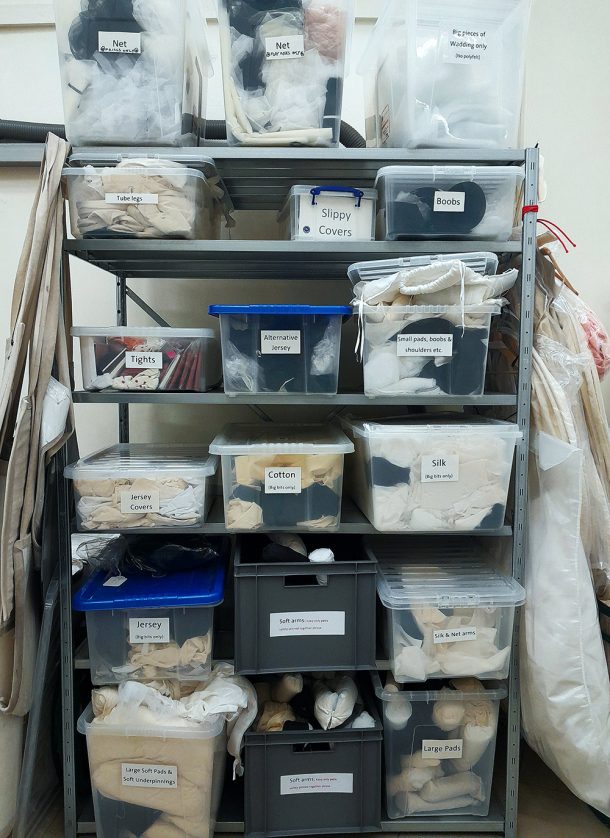 Stacked boxes of cutoff fabric in the Textiles Conservation Studio