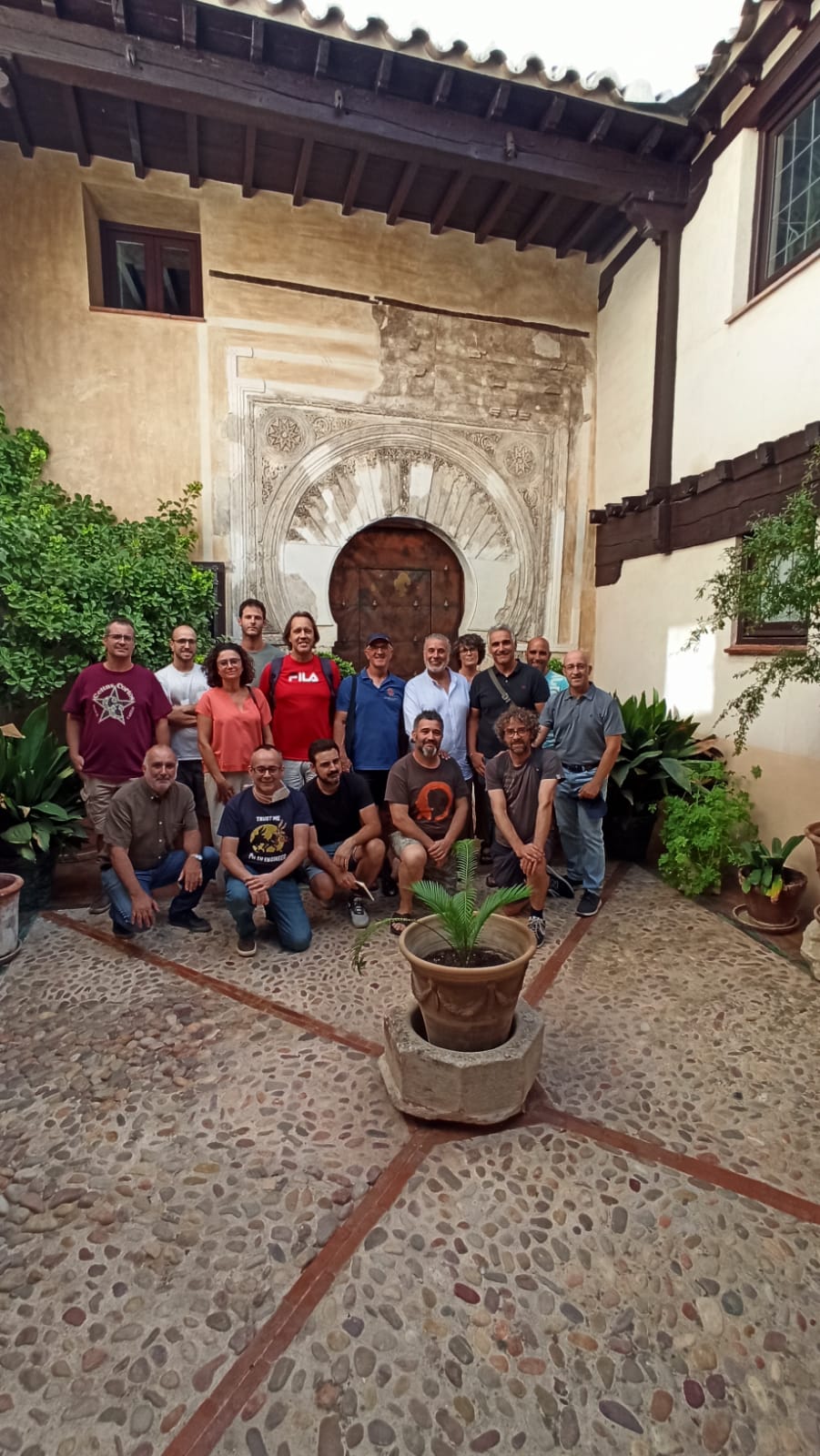 The carpentry group in front of Spanish house