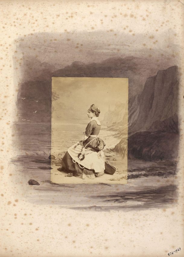 Page of a scrapbook showing a seated woman