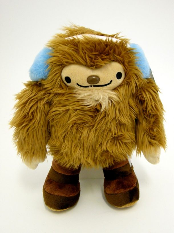 Furry toy with blue ear muffs