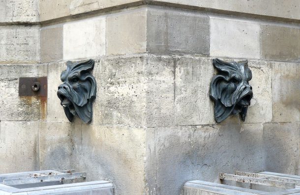 Two mascarons on the Fontaine des Quatre-Saisons, Paris. Photograph uploaded to Wikipedia by Siren-Com