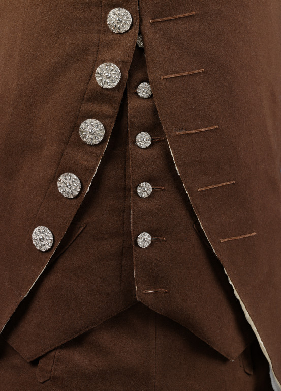 Raw edges on the front of the coat and waistcoat. The hint of white you can see is the silk lining.