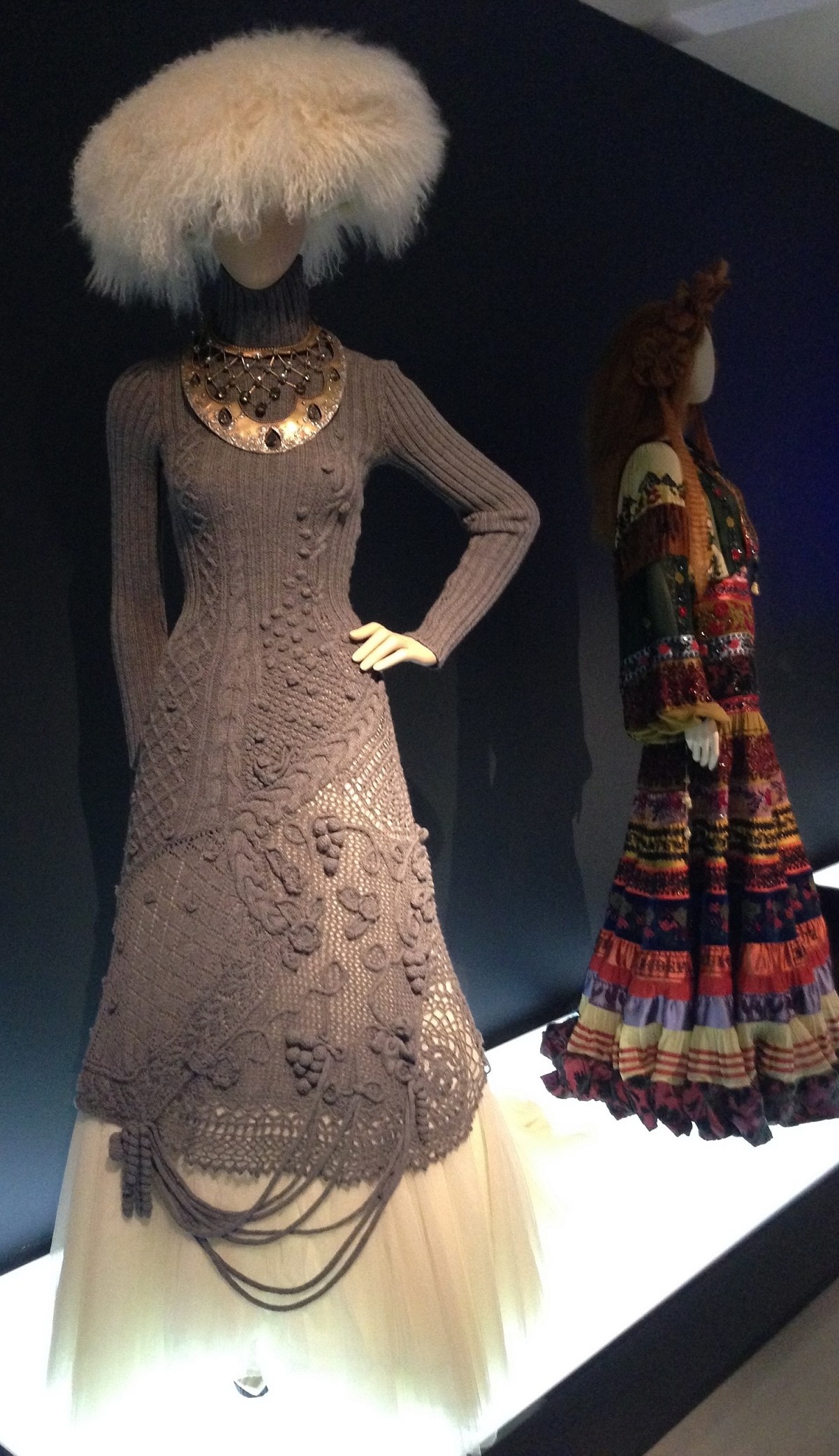 knitted dress in the foreground with a dress from one of Gaultiers ethnographic collections. © Katherine Elliott, 2014
