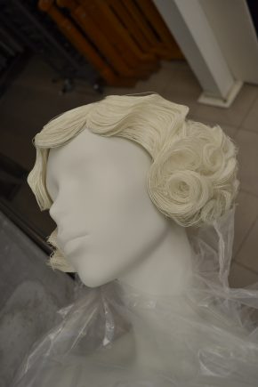 Sample wig from Gems Ltd produced from period reference material. The paint finish was considered too pale and further layers were added to match the mannequin face.
