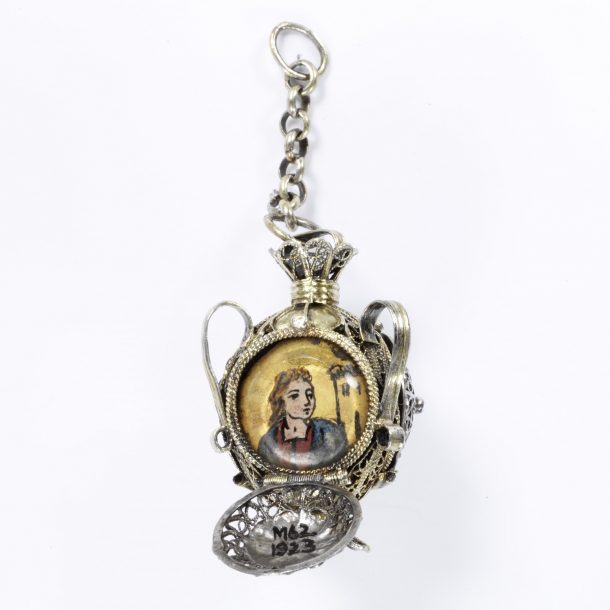 Pendant enclosing three religious paintings, including one of St. Barbara, silver, Spain, 19th century, museum no. M.62-1923 © Victoria and Albert Museum, London