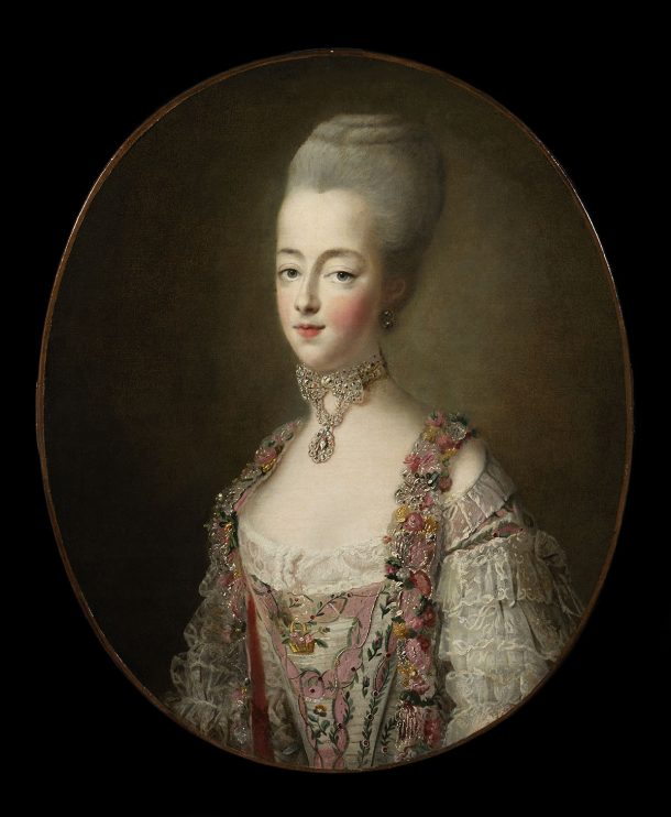 A woman looks out from the canvas, wearing a set of jewels around her neck