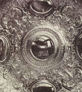 Decorative Plate or Salver; silver-gilt; owned by The Arundel Society, Science & Art Department, possibly by Charles Thurston Thompson (1816 - 68); Accession number 67543; ©Victoria & Albert Museum, London., showing centre with reflection.