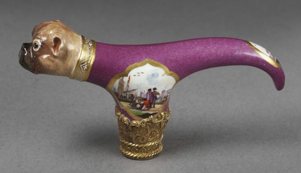Cane handle of hard-paste porcelain, modelled as a pug dog, painted in enamels and mounted in gold in England, 1820-1830, made by Meissen porcelain factory, Germany, 1736-1740. V&A C.1016-1919