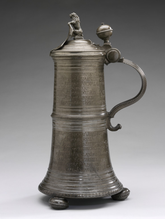 9086-1863 Tankard Pewter Guild tankard with inscriptions and lid with shield and lion figure. German, 1704. Joseph Dor Germany 1704 Pewter with engraved inscriptions.