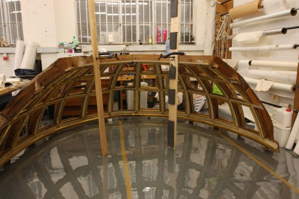 Part of the ceiling of the mirrored cabinet, during conservation