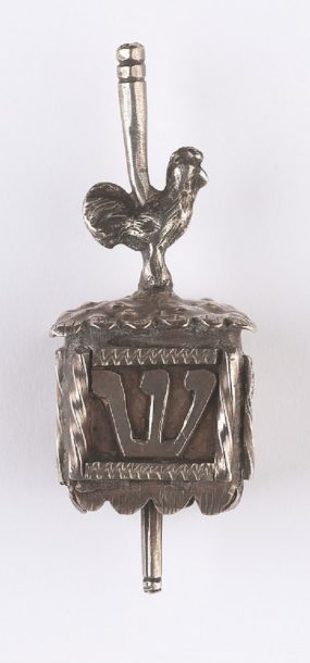Hanukkah dreidel; silver. Courtesy of Jewish Museum London. Museum no. C1975.6.23.1