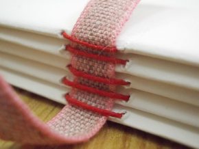 Model of a case binding showing sewing method