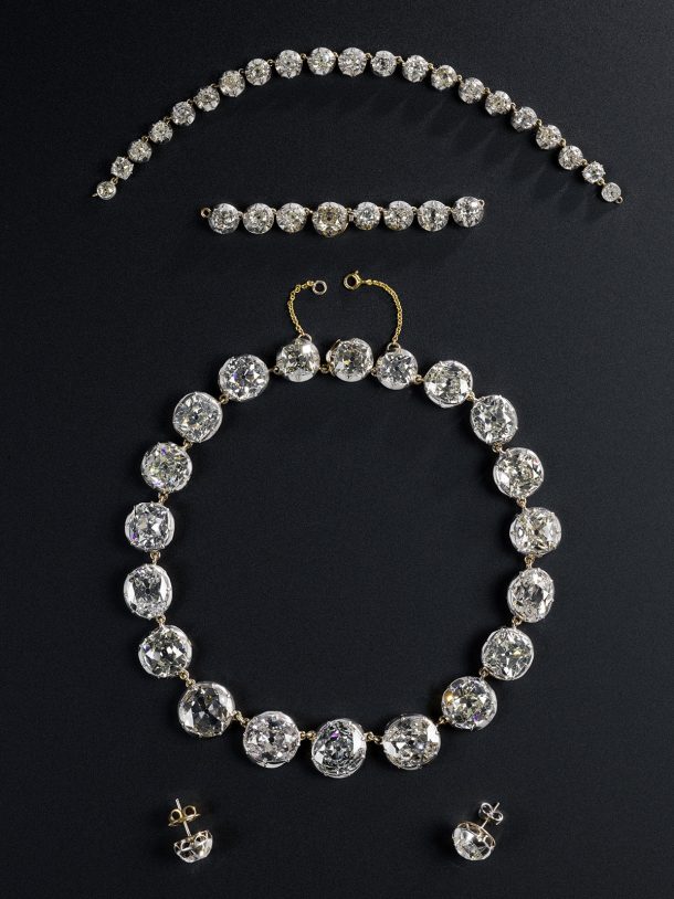 A group of jewels, set in a necklace, earrings and two separate sections