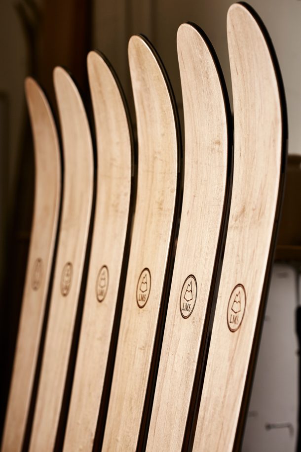wooden skis lined up next to each other