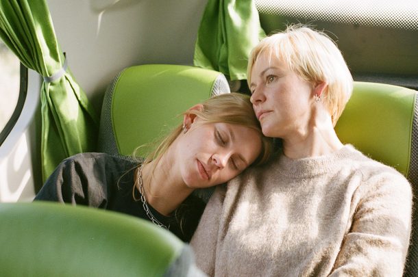 Two people on a journey, one sleeping