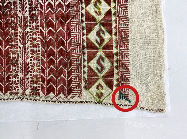 Corner of an embroidered veil, with small variations in the pattern made for good luck