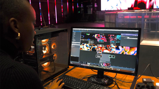 Olivia Ema interesting with computer to control audio visuals for a performance