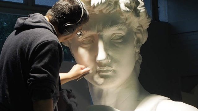 Lead sculptor smoothing finish surface coat of plaster. Image courtesy of the 20th Century Fox