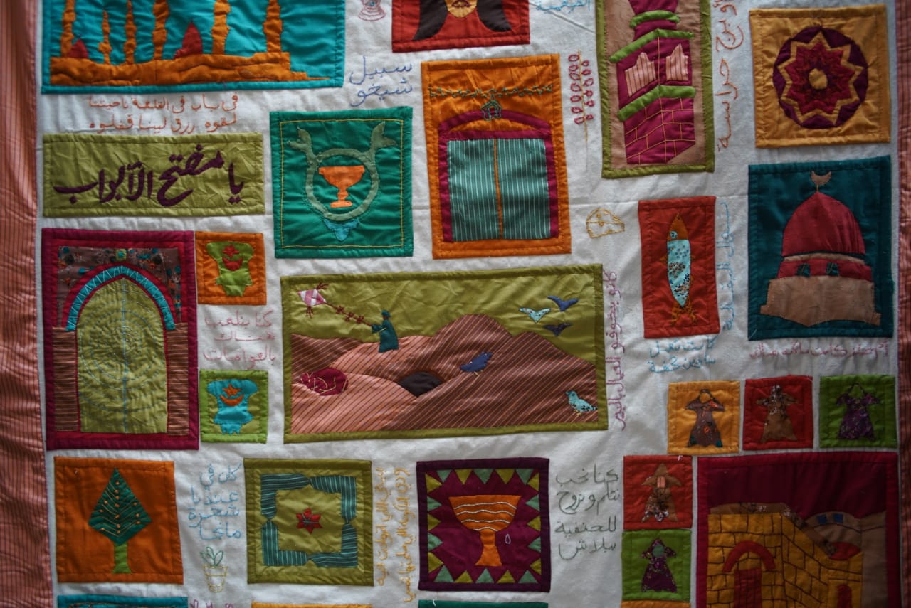 A close-up shot of a colourful wall hanging