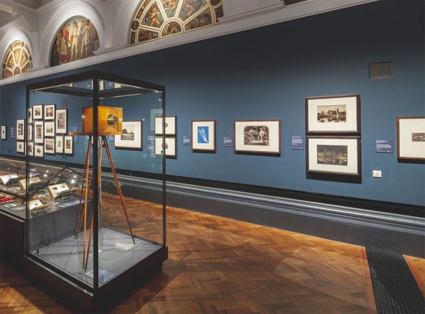 A gallery interior showing one of Anna Atkins' photographs