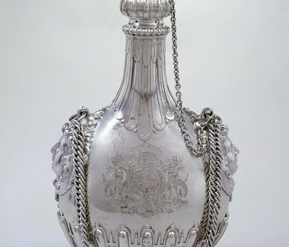 A silver pilgrim bottle with stopper