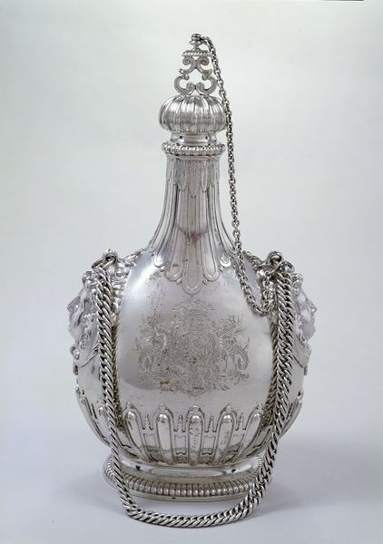 A silver pilgrim bottle with stopper