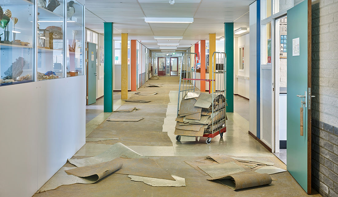 A long corridor with removed flooring