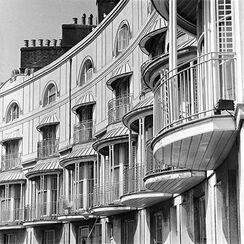Facade of building with iron balcony, Brighton