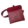 Red leather crossbody bag. The bag is open to show the embossed floral details and logo.